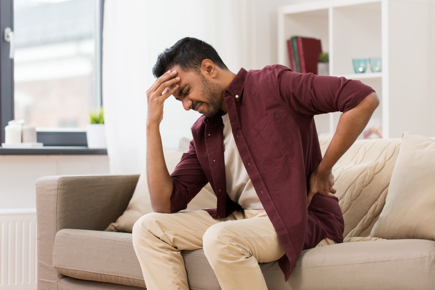 Person struggling with body pain.