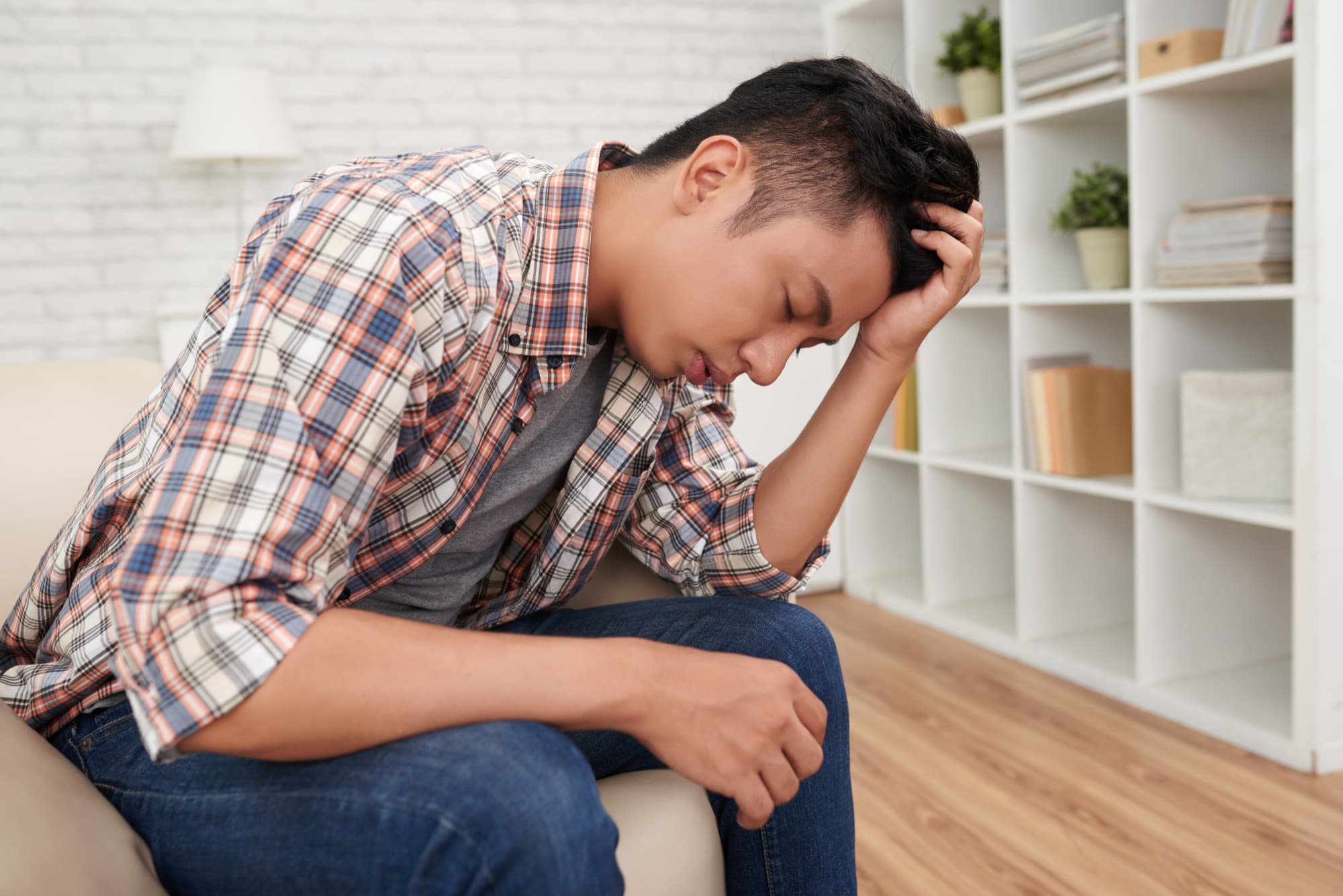 A person suffering from depression and looking to start therapy in Singapore.