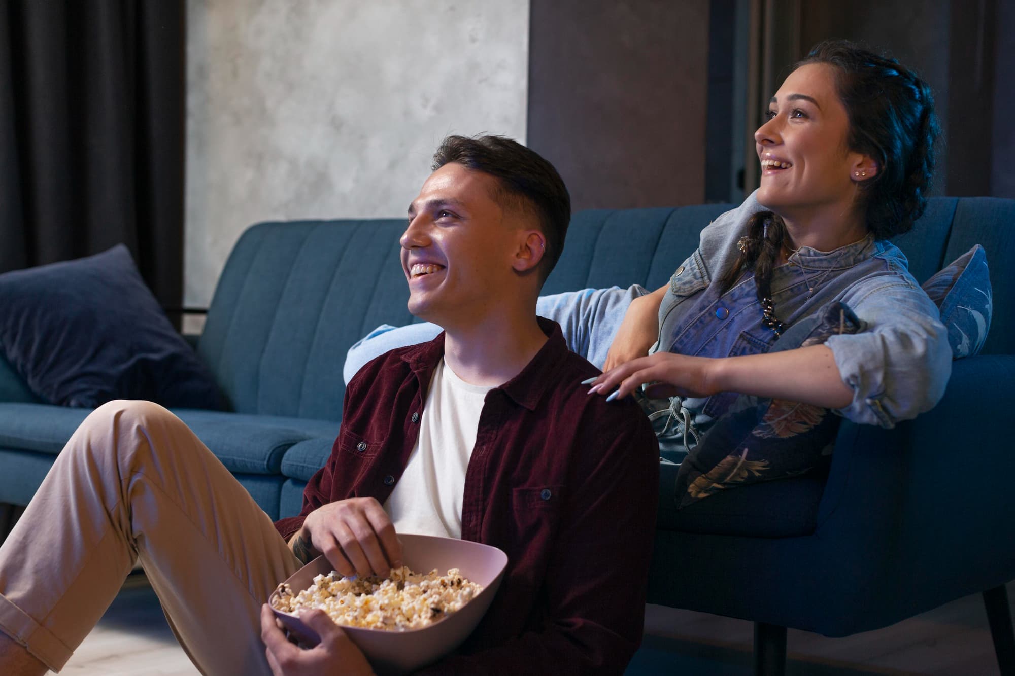 Two friends watching a movie or TV show with a relatable mental health representation..