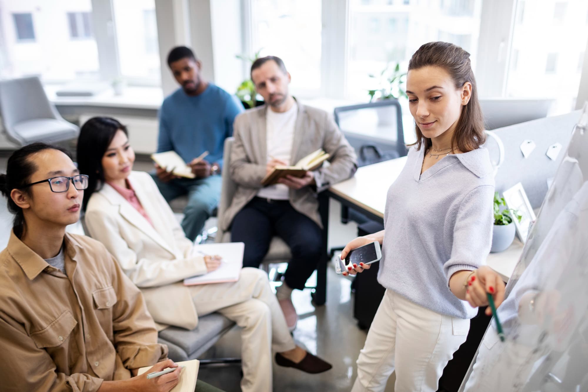 A corporate team engaged in a workshop through their company's Employee Assistance Program.
