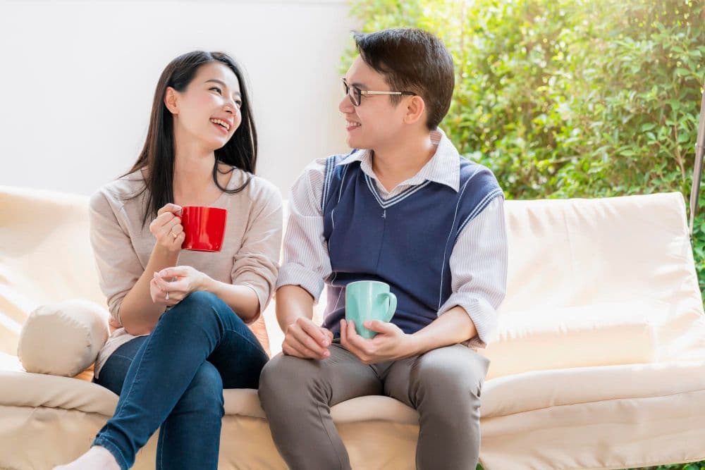 A couple trying to communicate after learning skills from marriage counselling in Singapore.
